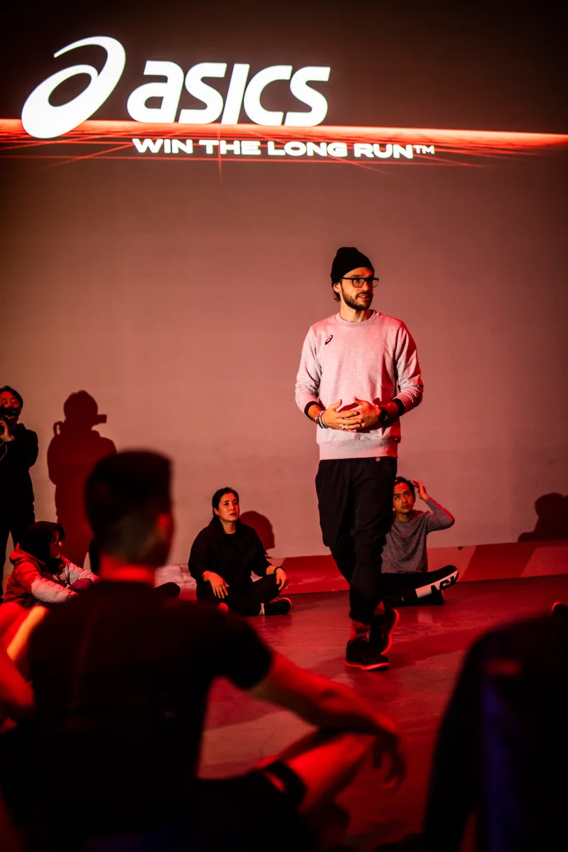 Chevy Rough presenting at an ASICS event